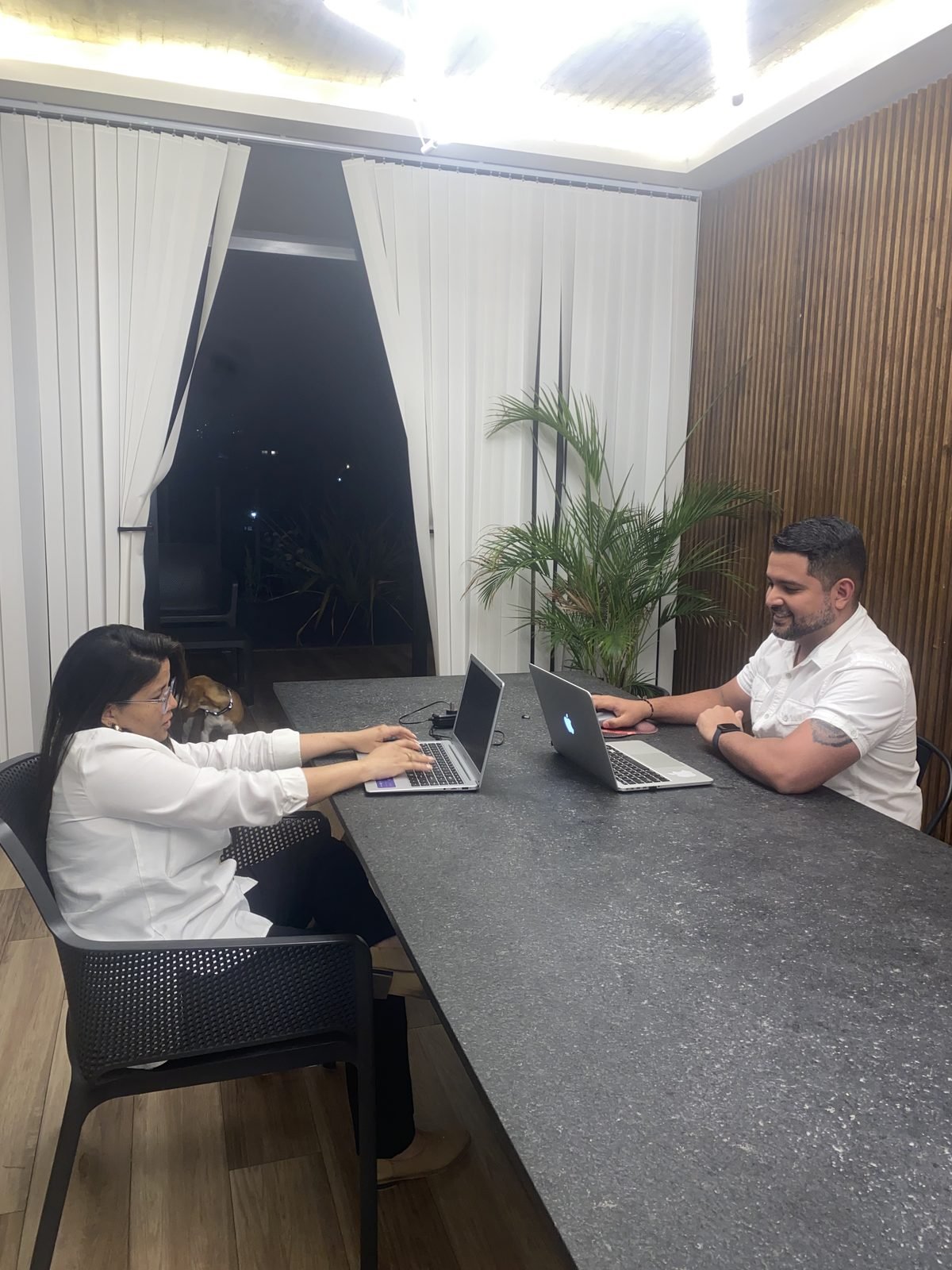 Vicente and Ladybeth Rojas working on a client's marketing